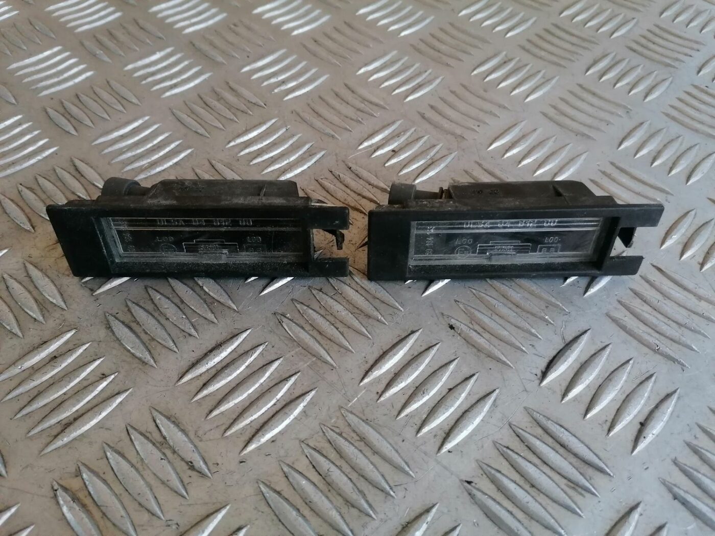 Numura zīmes apgaismojums priekš OPEL MERIVA 2004 2 Numura zīmes apgaismojums priekš OPEL MERIVA 2004