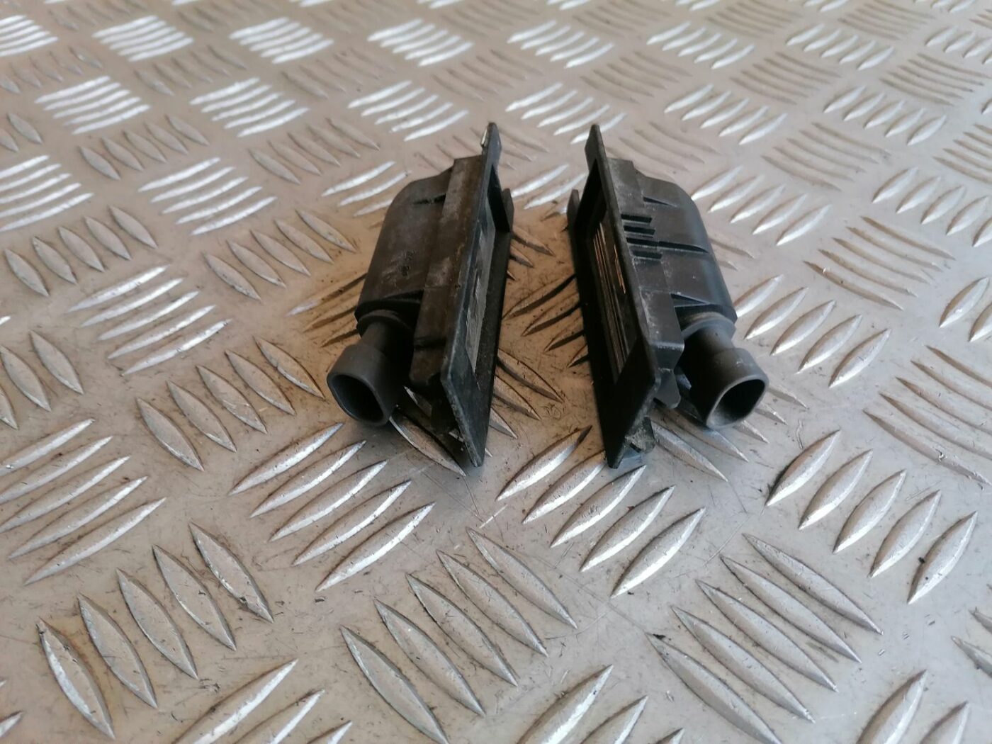 Numura zīmes apgaismojums priekš OPEL MERIVA 2004 3 Numura zīmes apgaismojums priekš OPEL MERIVA 2004